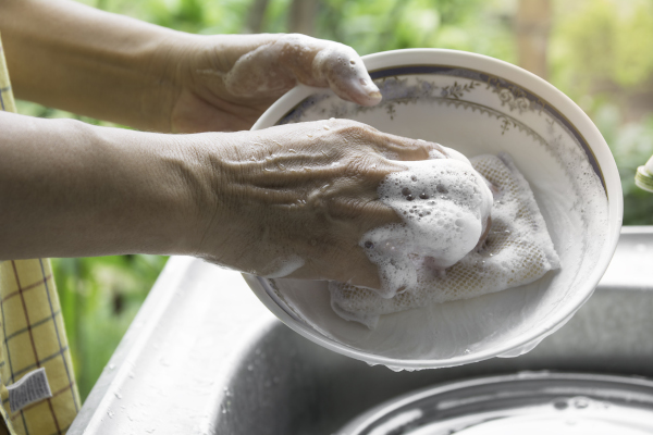 A person washing dishes