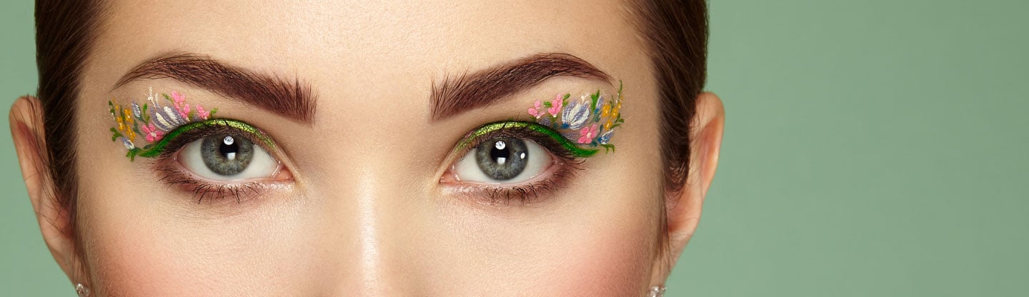 Close up of a woman with flower eye makeup