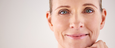Close up view of an older woman with glowing skin and no makeup